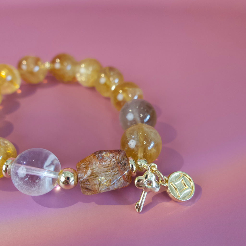 Golden natural stone bracelet worn on wrist