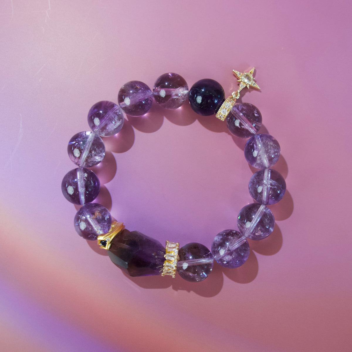Purple amethyst crystal bracelet worn on wrist