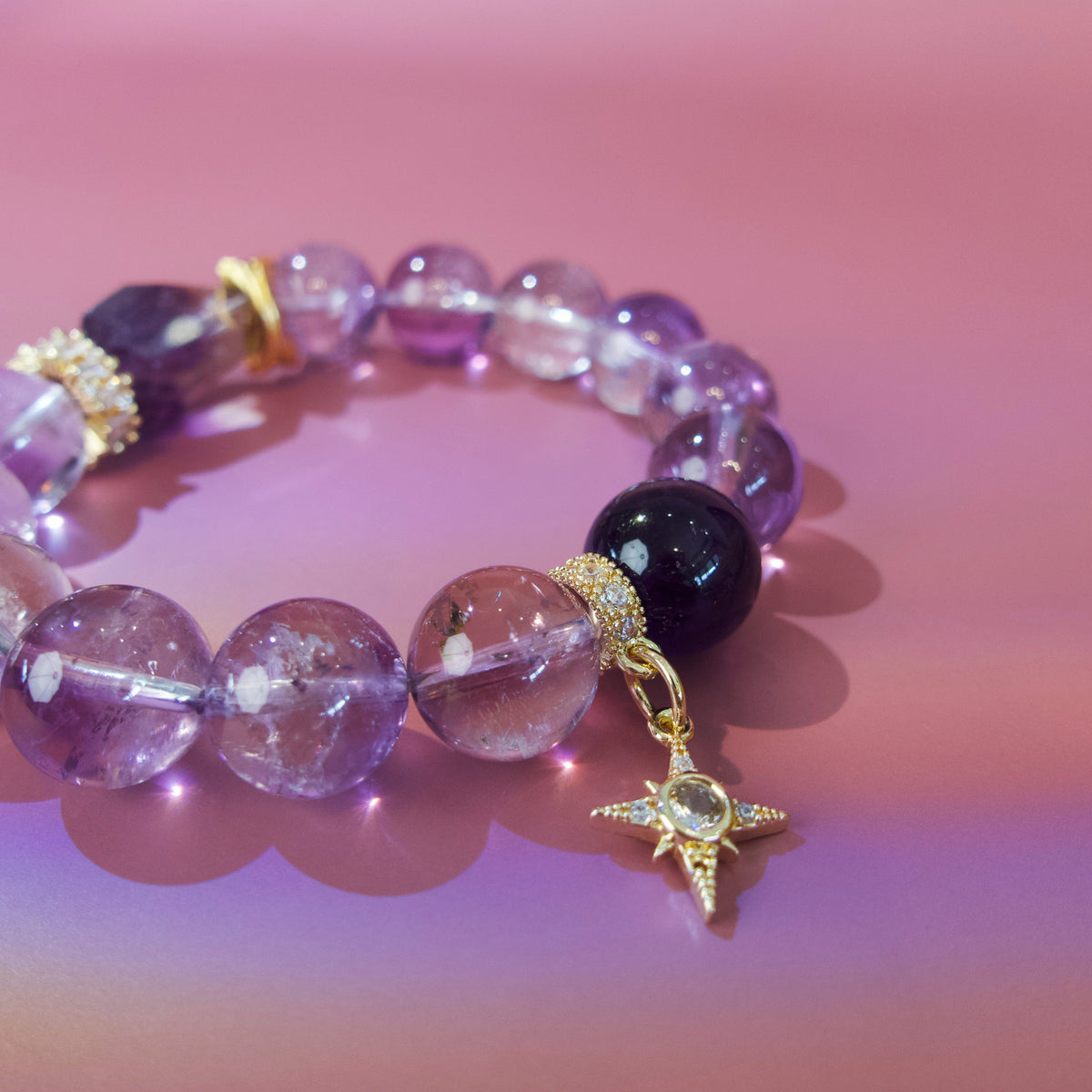 Close-up of Super Seven, Brazilian amethyst and gold symbolic details