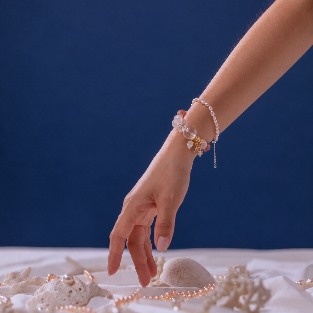 Pink natural stone bracelet worn on wrist