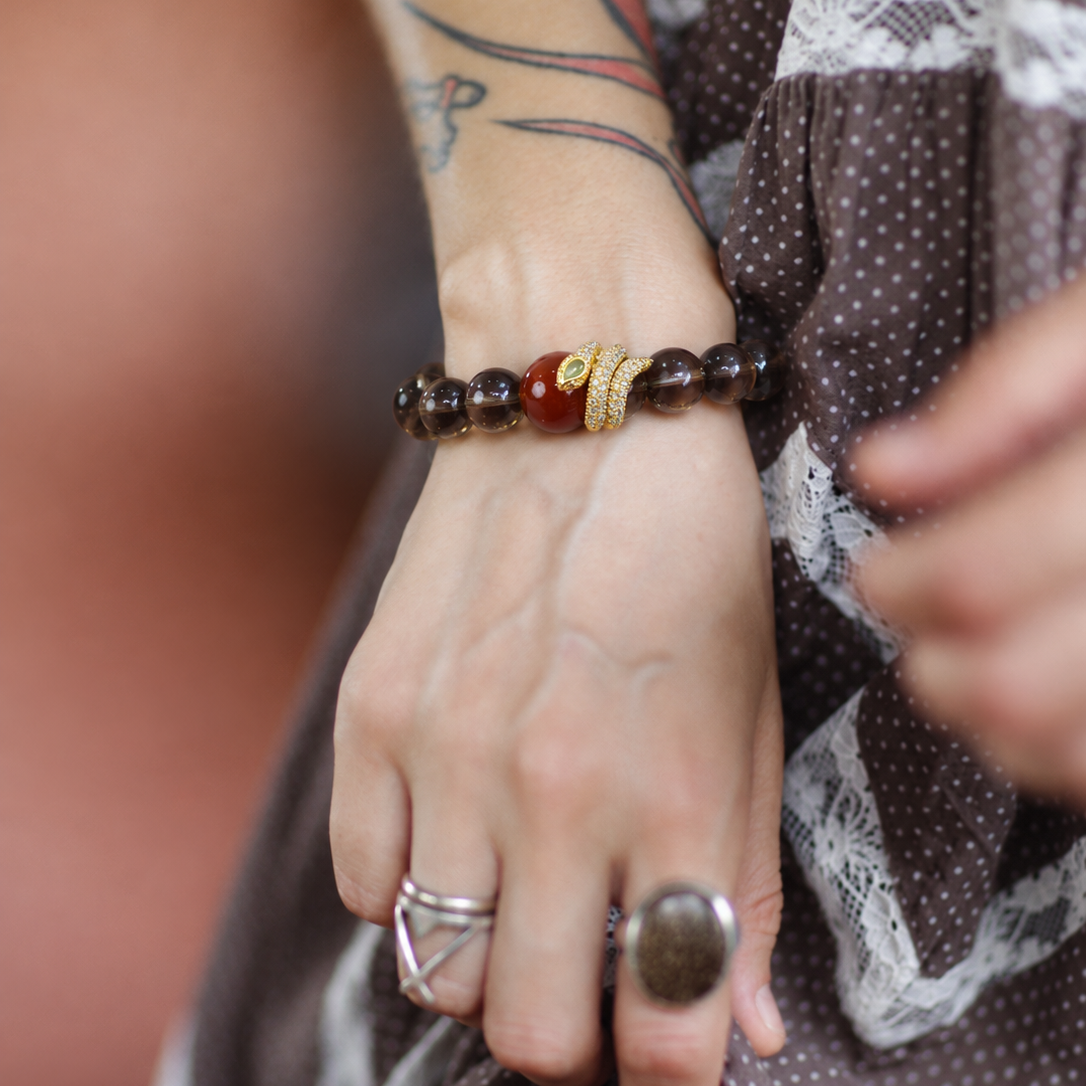 Smoky quartz and red agate bracelet worn on wrist