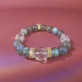 Grey moonstone bracelet with white crystal focal bead and gold details