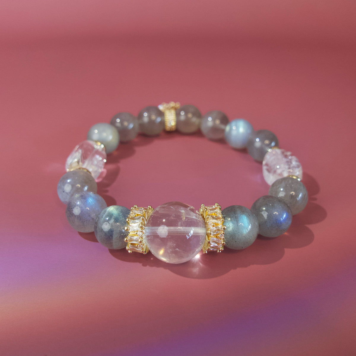 Grey moonstone bracelet with white crystal focal bead and gold details